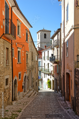 Fototapeta Naklejka Na Ścianę i Meble -  A narrow street between the houses of Morcone, a medieval village in the Campania region in Italy