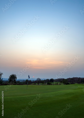 Golf course at sunset in Hua Hin, Thailand. Golf courses are now closed due to the coronavirus containment orders.