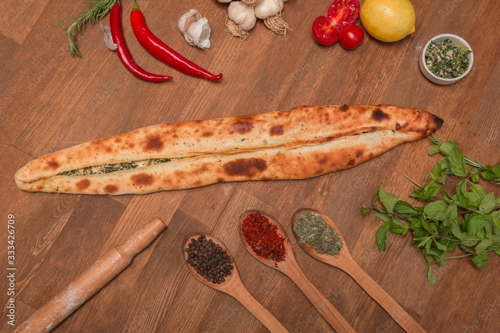 Pita from turkish cuisine on the wooden board Pita from turkish cuisine on the wooden board