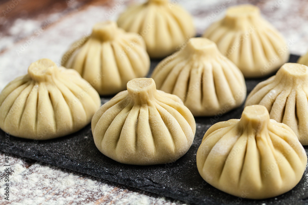 raw dumplings khinkali ravioli in flour raw dumplings khinkali ravioli in flour