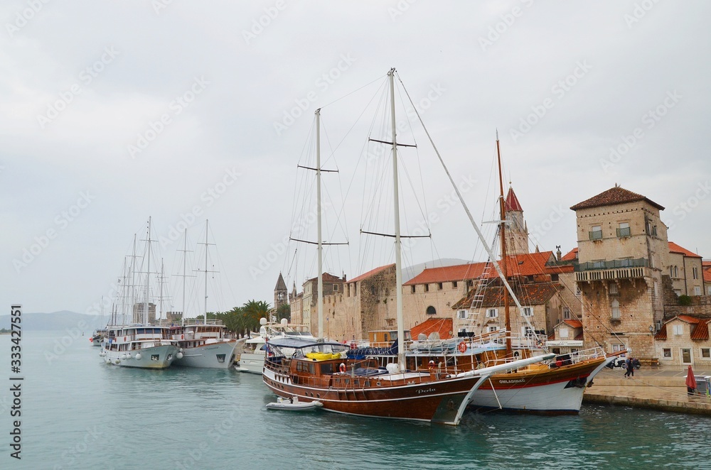 boats in the harbor of Trogir at a rainy day
