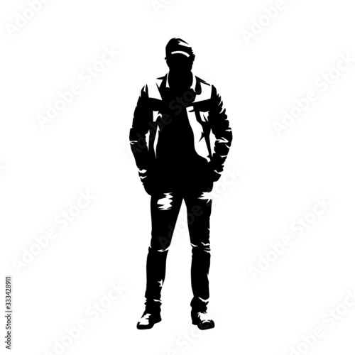 Man with cap standing with hands in pockets, casual clothing. Isolated vector silhouette. Front view. Young adult person