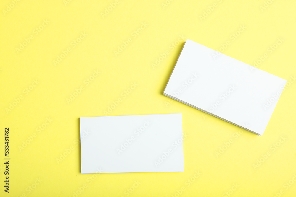 business cards on a colored background top view. Place to insert text