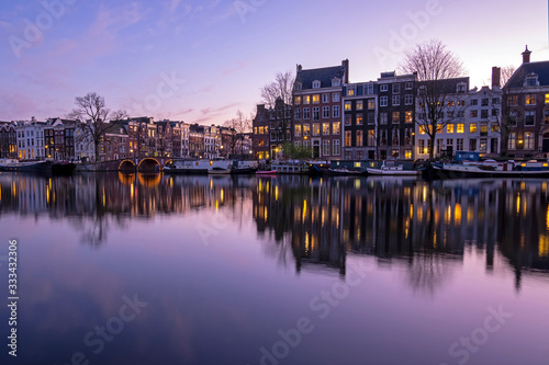 City scenic from Amsterdam  at the Amstel in the Netherlands at sunset