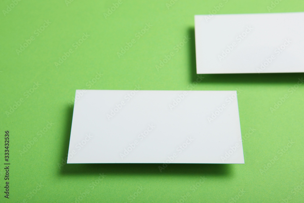 Fototapeta premium business cards on a colored background top view. Place to insert text