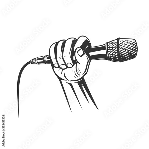 Hand holding a microphone in a fist.