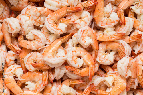 Boiled and peeled shrimps background