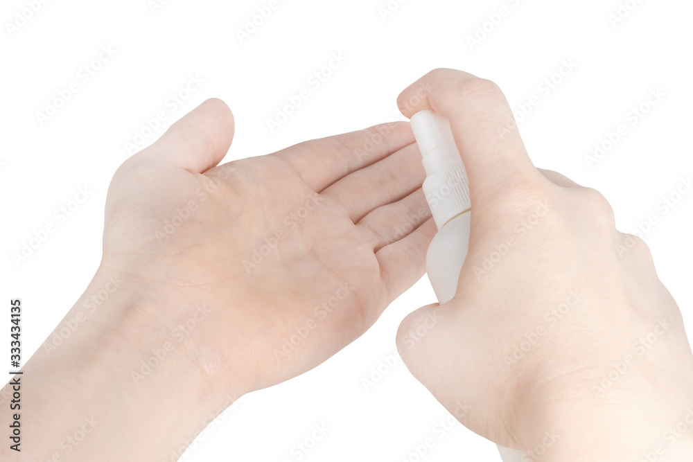 Naklejka premium bottle with antibacterial antiseptic spray in hand isolated on white background