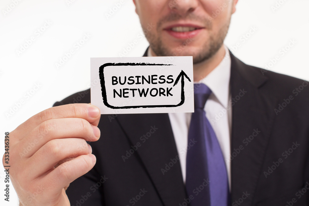 Business, Technology, Internet and network concept. Young businessman working on a virtual screen of the future and sees the inscription: Business network Business, Technology, Internet and network concept. Young businessman working on a virtual screen of the future and sees the inscription: Business network