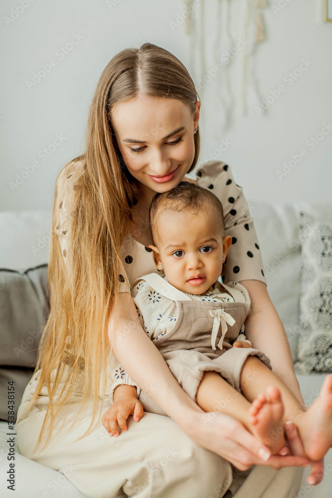 Happy mom and girl in home interior. Mothers Day. Happy mom and girl in home interior. Mothers Day.