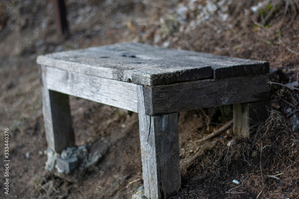 Naklejka premium old wooden bench in the forest