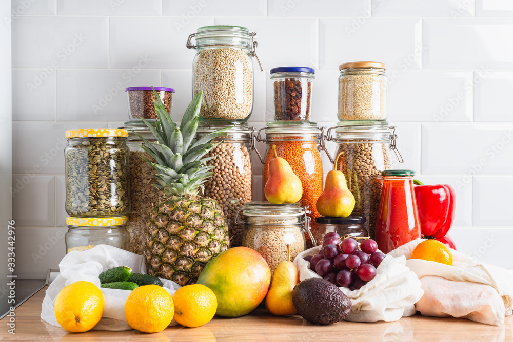 Fruits, vegetables, legumes, grains, seeds on a kitchen counter. Zero waste storage Fruits, vegetables, legumes, grains, seeds on a kitchen counter. Zero waste storage