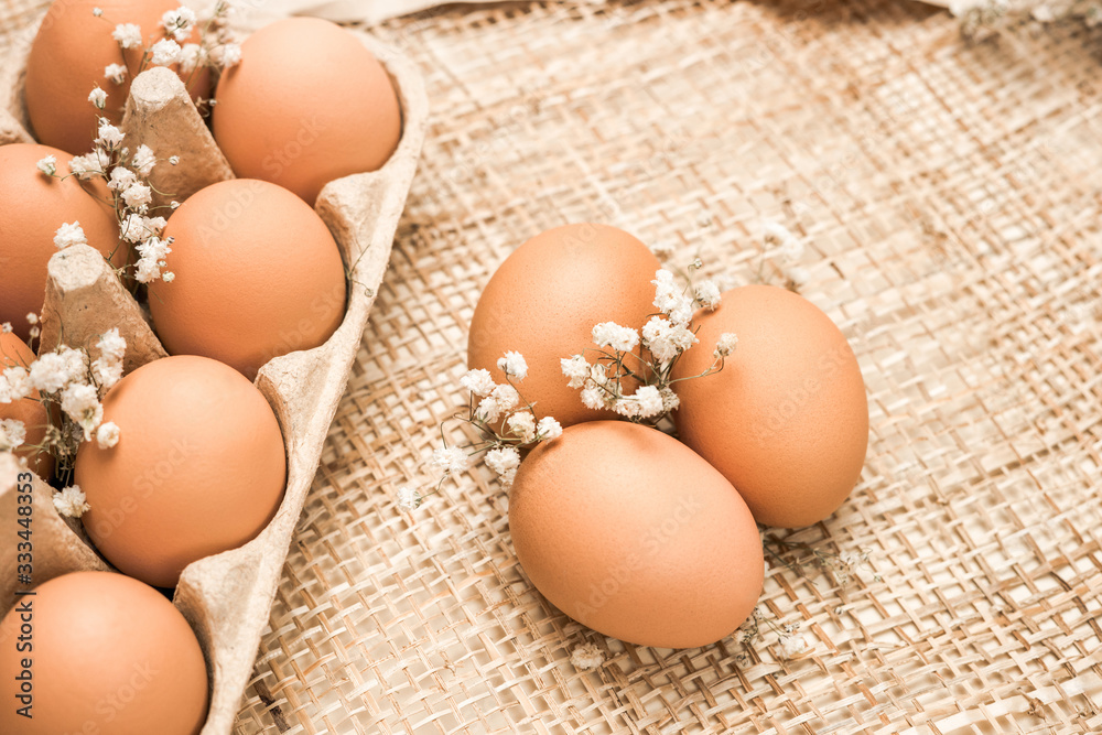 Brown fresh hen's eggs on textile. Eco-friendly egg production. Baking ingredients. Organic chicken eggs - fresh from producer. Trend of minimalism. Eco Easter concept. 