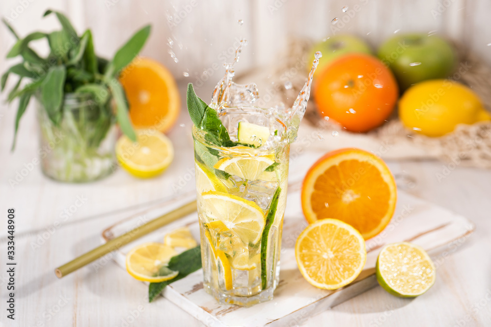 The glass of fresh lemonade with drops of a liquid splash The glass of fresh lemonade with drops of a liquid splash