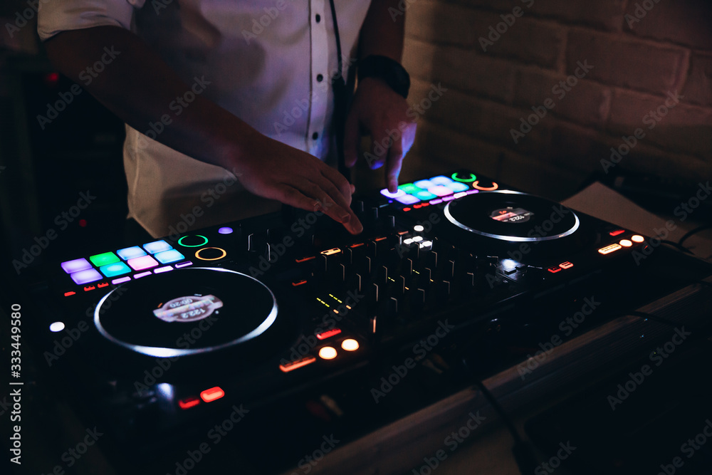 Obraz premium glowing lights from dj mixer music remote buttons