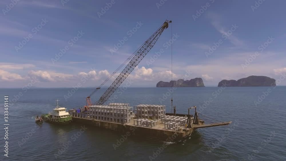 Sky view of blue sea island and construction barge ship working in the sea with 4K footage. Sky view of blue sea island and construction barge ship working in the sea with 4K footage.