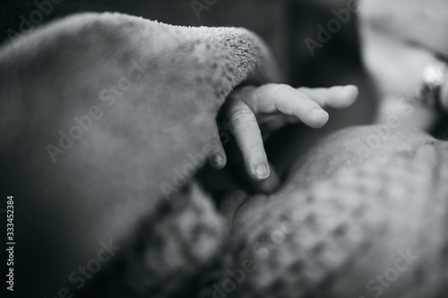 close up photo of newborn baby's hand © wideeyes