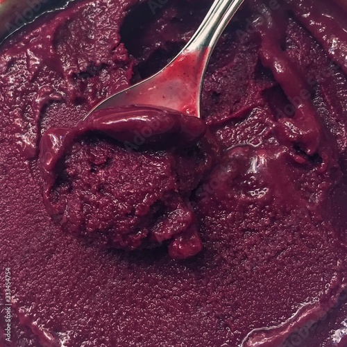 Acai berries bowl are popular detox and healthy superfoods in Brazil, Hawaii and Baja California. Purple mashed frozen Acai berries is very delicious vegan antioxidant  food.
