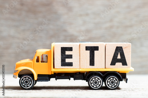 Valokuva Truck hold letter block in word ETA (abbreviation of estimated time of arrival)
