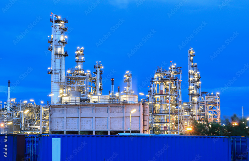 The oil refinery industry, petroleum, petrochemical plants full of technology. And the blue background, orange lights