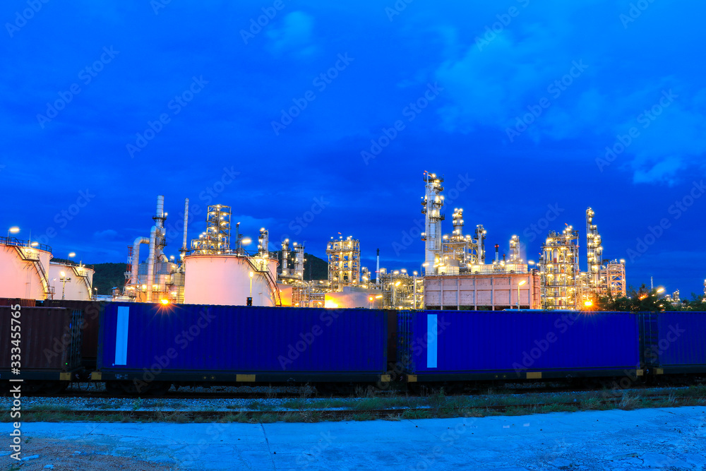 The oil refinery industry, petroleum, petrochemical plants full of technology. And the blue background, orange lights