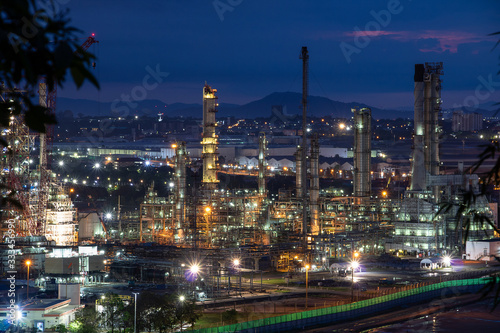 Refinery and industrial natural gas tanks with the backdrop of the morning sky © Rangsarit
