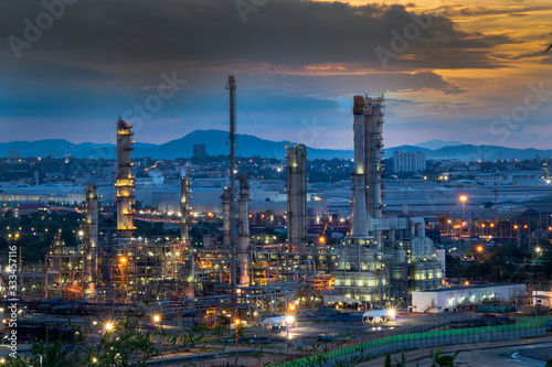 Refinery and industrial natural gas tanks with the backdrop of the morning sky © Rangsarit