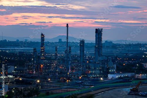 Refinery and industrial natural gas tanks with the backdrop of the morning sky