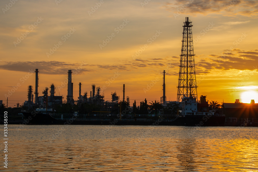 Oil refinery industry and Petrochemical and natural gas and oil storage tanks, orange background