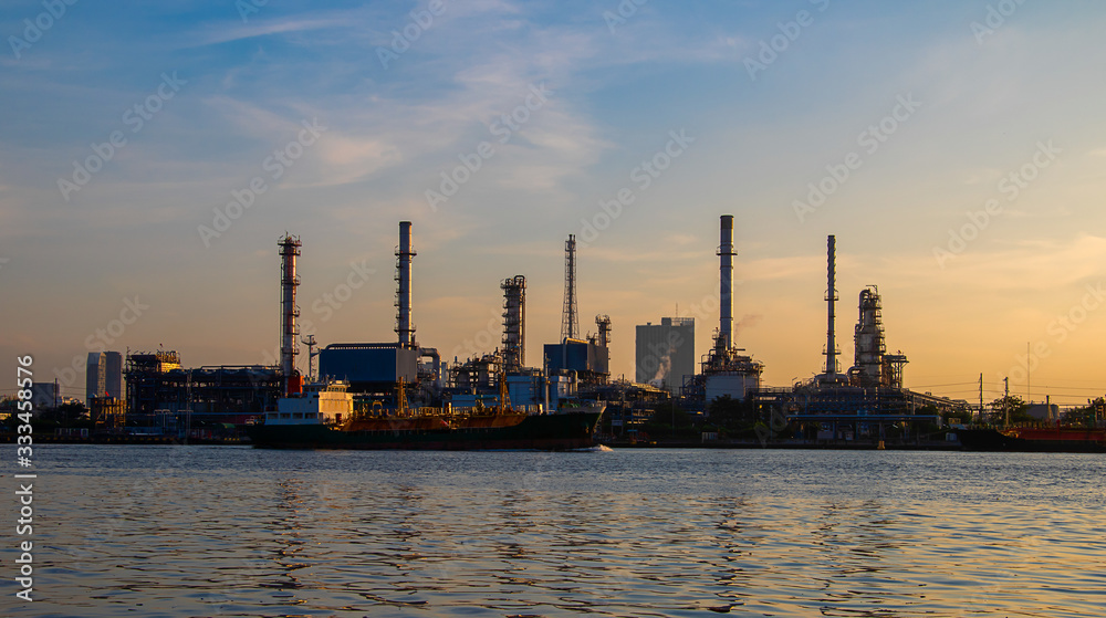 Oil refinery industry and Petrochemical and natural gas and oil storage tanks, orange background Oil refinery industry and Petrochemical and natural gas and oil storage tanks, orange background