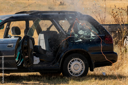 An improvised explosive device is detonated inside of a vehicle using det cord 