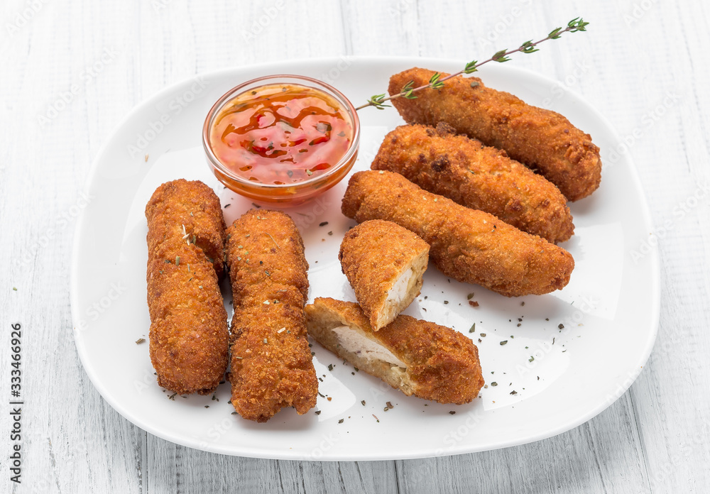 Fried chicken nuggets with ketchup on a plate Fried chicken nuggets with ketchup on a plate