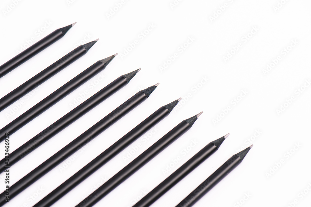 flat lay with black wooden pencils isolated on white flat lay with black wooden pencils isolated on white
