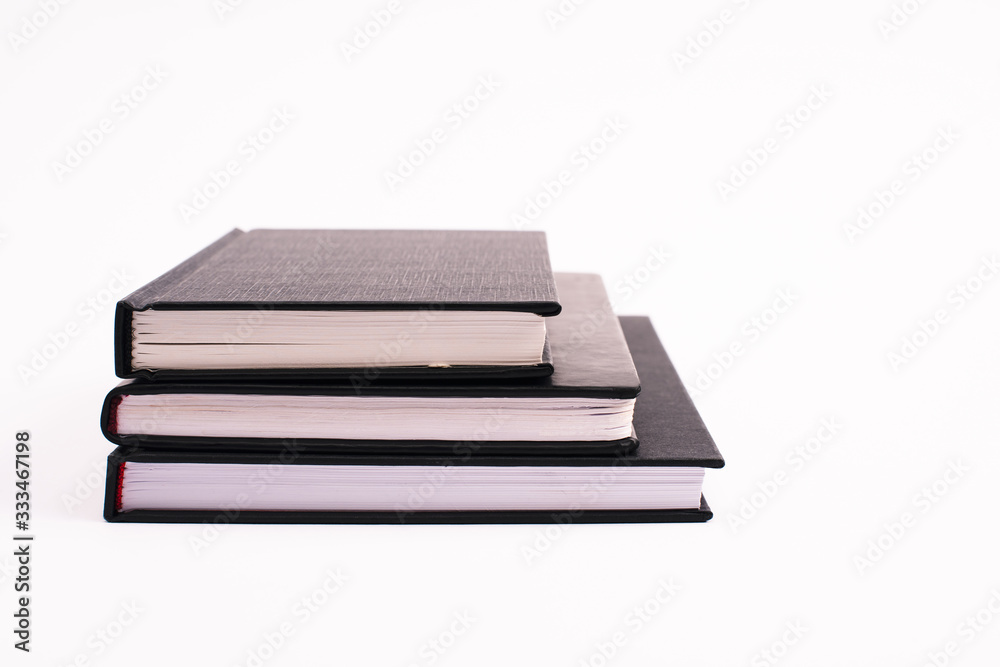 black copy books isolated on white with copy space black copy books isolated on white with copy space