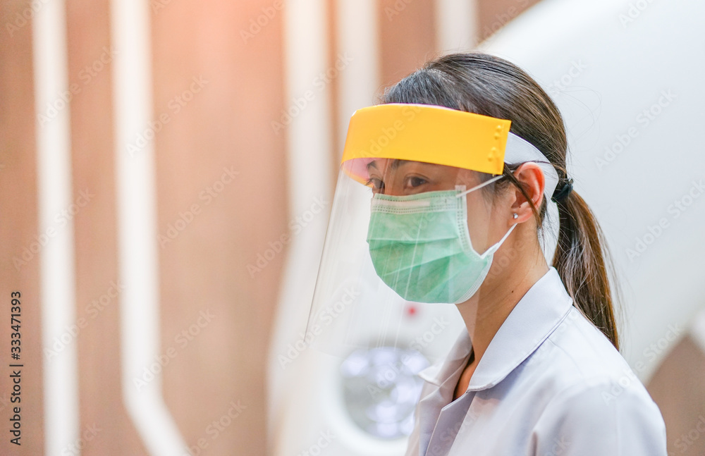 Medical staff wearing face shield, medical mask and medical grove for