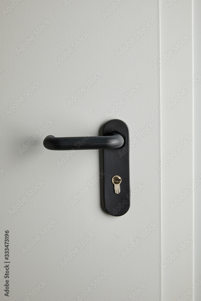 clean grey metal door with black handle after disinfection clean grey metal door with black handle after disinfection