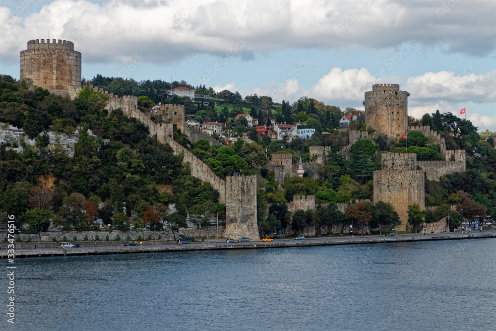 The thick Stone walls and Towers of the Rumeli Fortress at the narrowest point of the Bosphorus Straits in Istanbul.