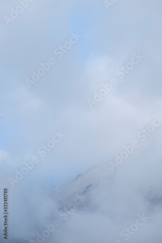 Clouds cover the top of a mountain near Assergi, Italy