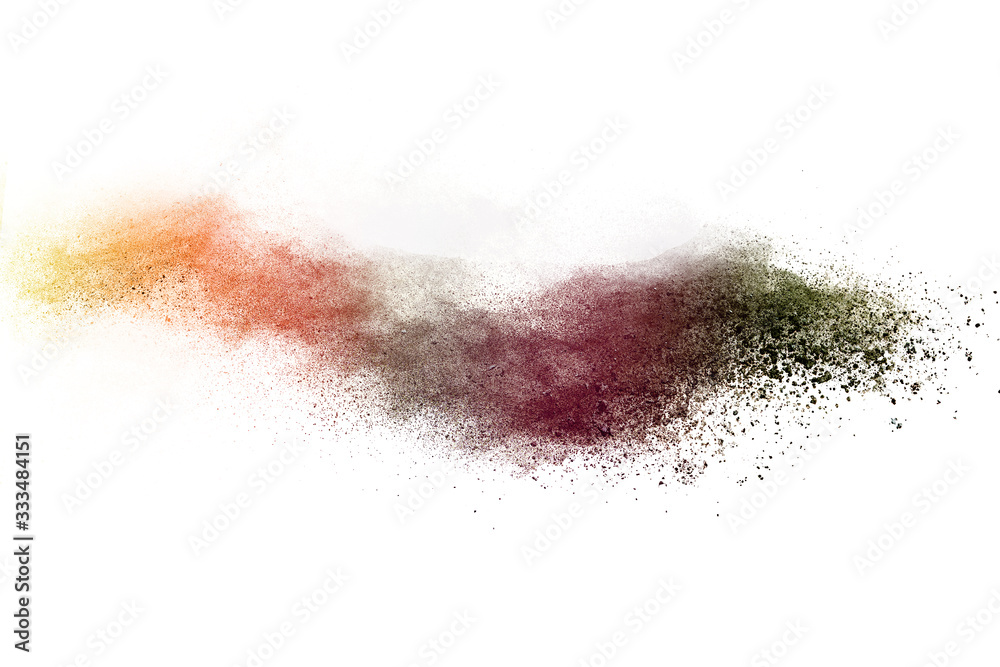 Freeze motion of brown color powder exploding on white background. 