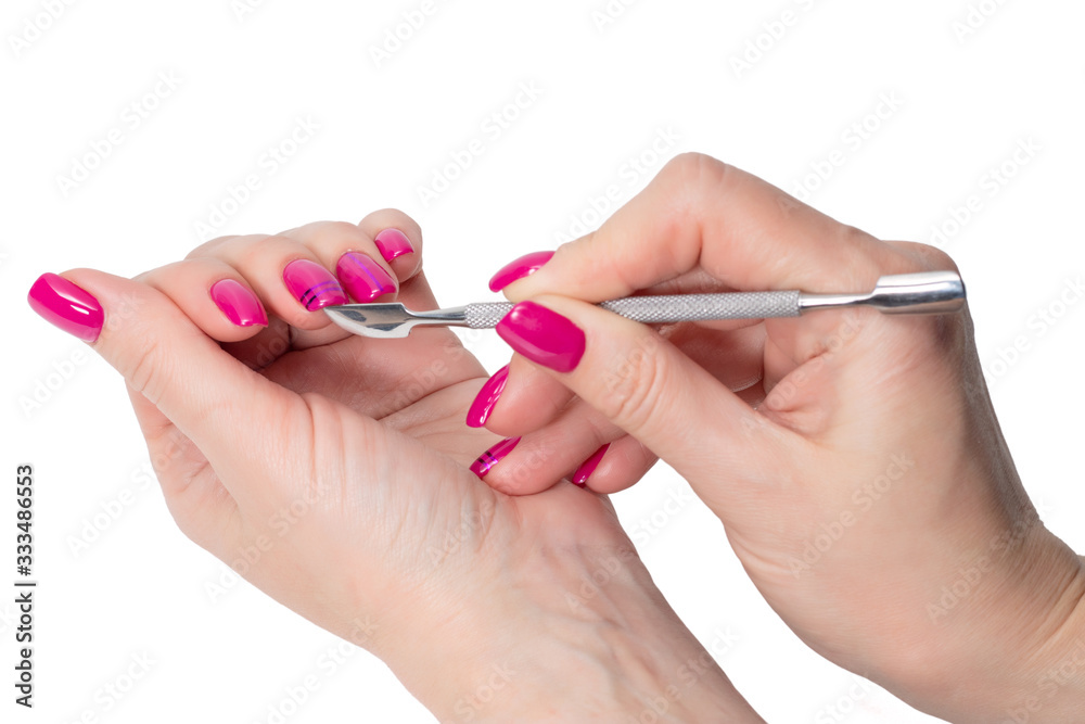 Woman receiving a manicure by a beautician isolate on white Woman receiving a manicure by a beautician isolate on white