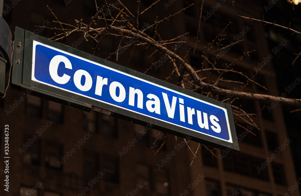Obraz premium Street sign with coronavirus word in New York City, USA.NY lockdown caused by coronavirus or covid-19 concept.