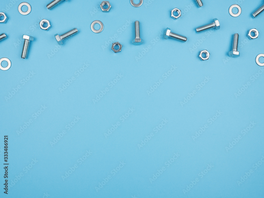 Bolts, nuts and other accessories on a blue background. Bolts, nuts and other accessories on a blue background.