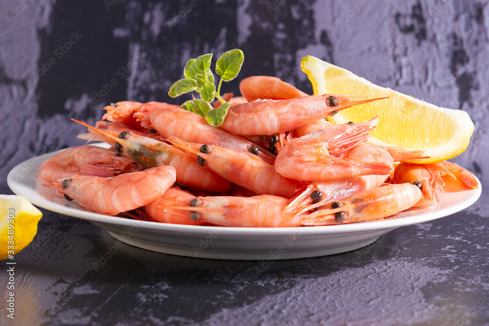 Fresh organic boiled shrimps with oregano twig macro view. Sea food background. Fresh organic boiled shrimps with oregano twig macro view. Sea food background.