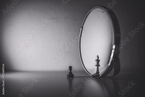 Chess: the pawn is the king in the mirror photo