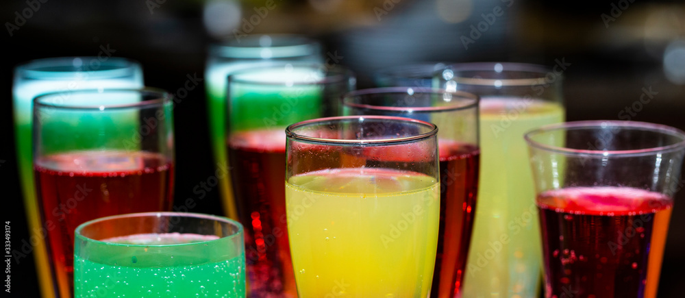 Glasses with a cocktail. Multicolored drinks. Drunk party. Glasses with a cocktail. Multicolored drinks. Drunk party.