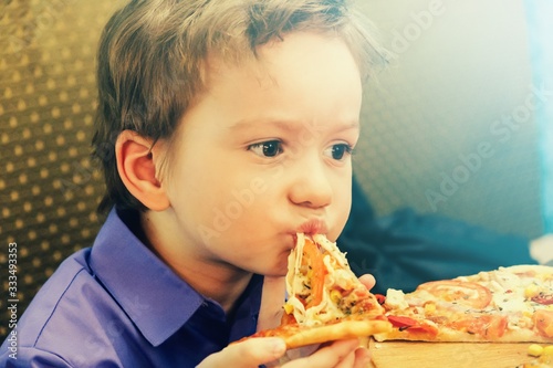 Hungry child eat slice pizza   little.Hungry child eat slice pizza   little.
