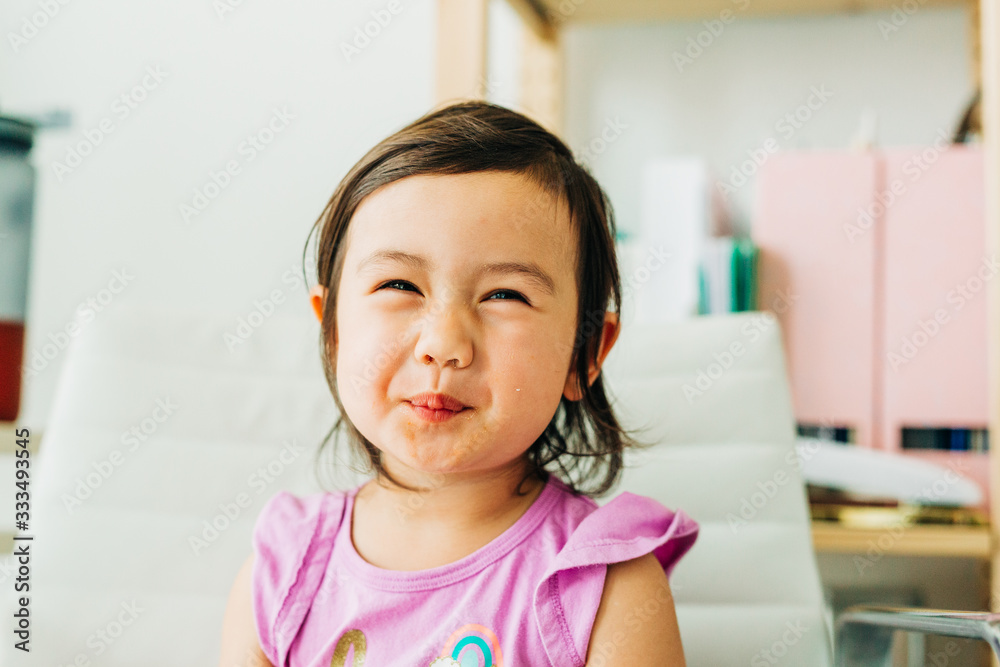 Toddler Girl Eating Banana Muffin Toddler Girl Eating Banana Muffin