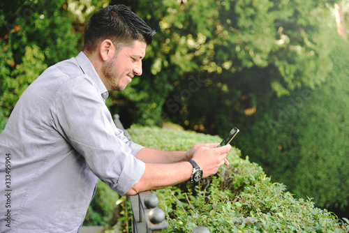 Happy man texting