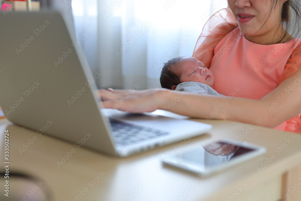 mother parenting a baby newborn sleeping in home office, businesswoman typing keyboard laptop computer of woman working freelance business mother parenting a baby newborn sleeping in home office, businesswoman typing keyboard laptop computer of woman working freelance business