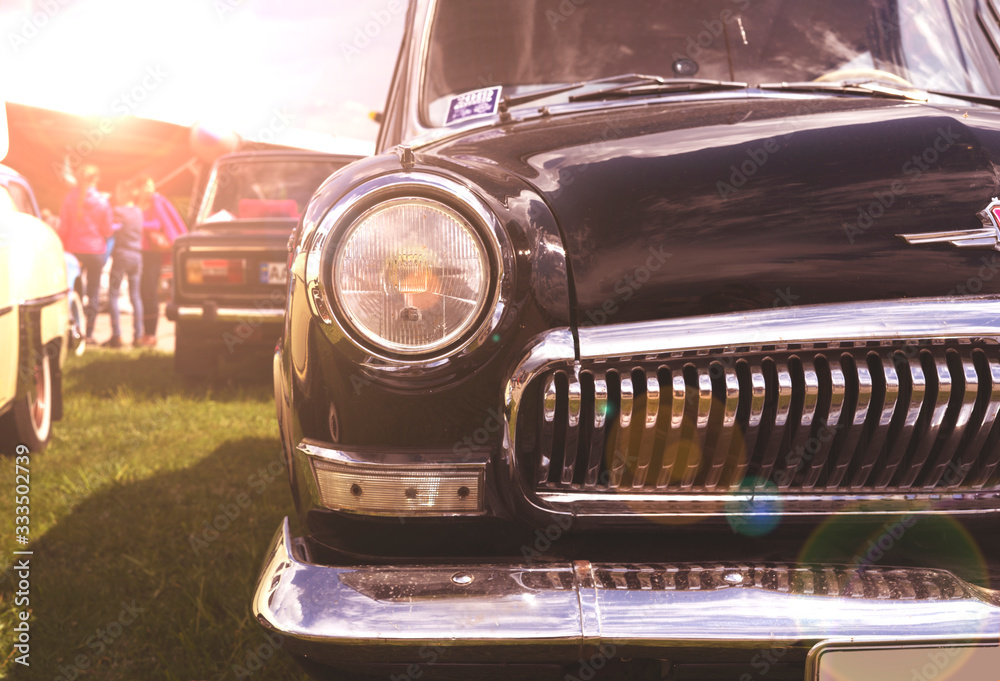 Fototapeta premium Vintage retro black car in the morning sun.